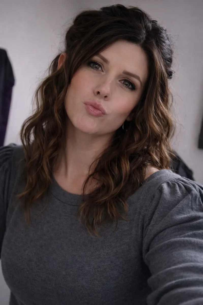 aveline marlowe ai crossdresser and female lifestyle blogger wearing a grey jumper and pouting